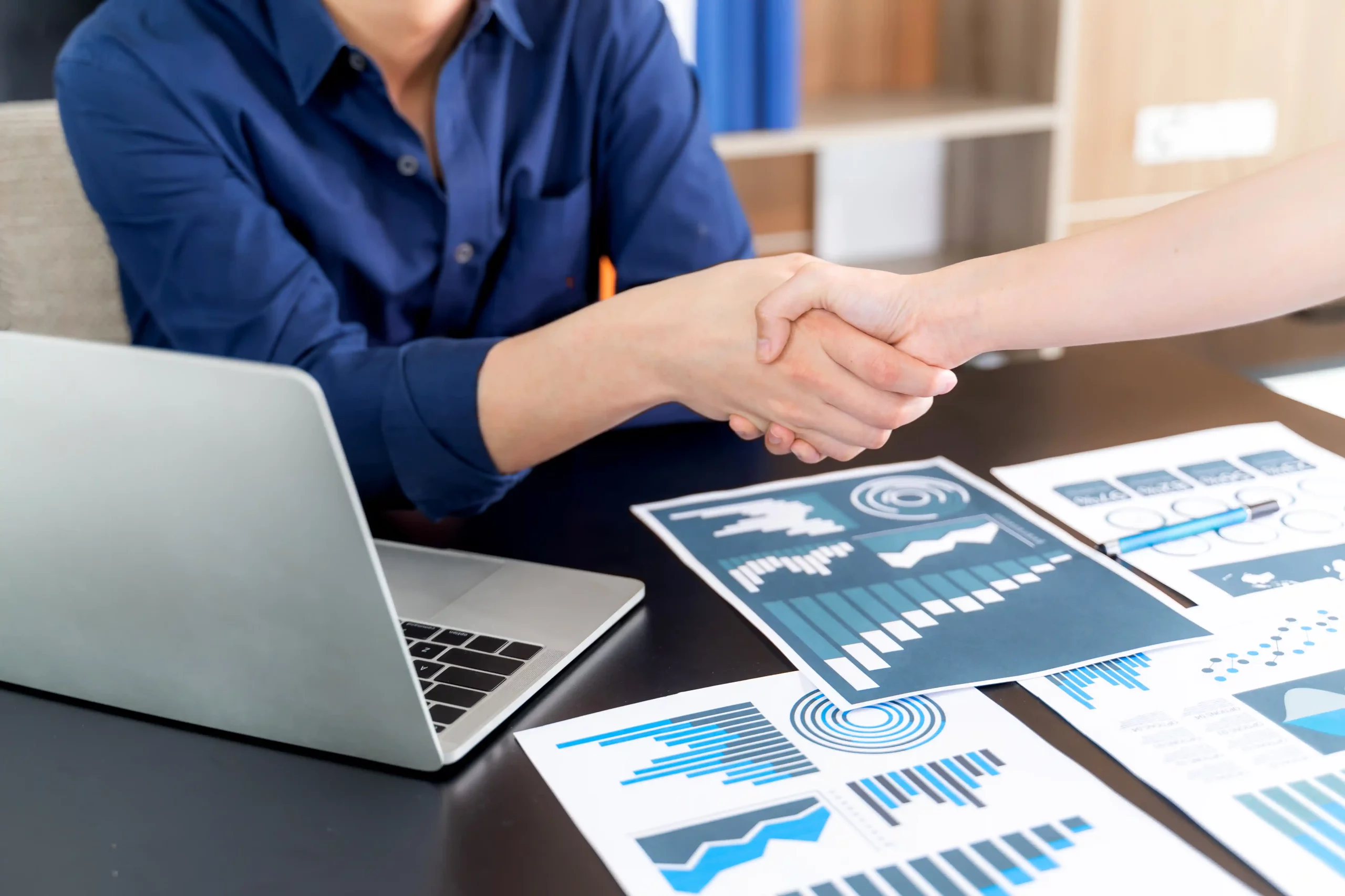 selective-focus-young-man-handshake-with-someone-office